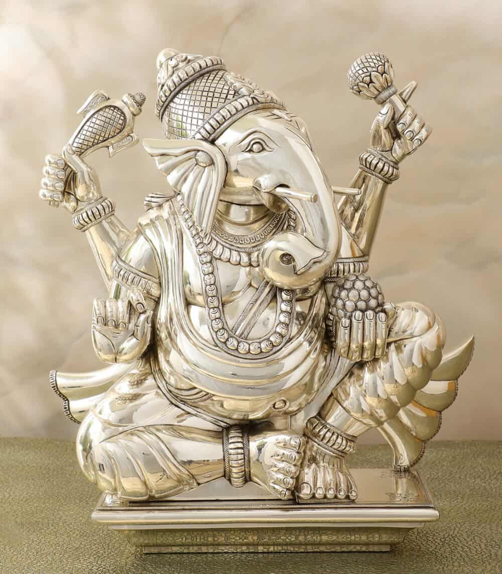 A beautifully crafted Silver God Idol of Ganesha Ayaan, featuring intricate details and traditional ornaments. The idol depicts Lord Ganesha in a seated posture, exuding serenity and spiritual elegance.